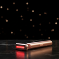 GlowVault Radiance Wand cinematic hero shot on dark marble with rose gold lighting